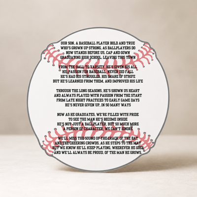 Baseball-shaped plaque with engraved text on a beige background