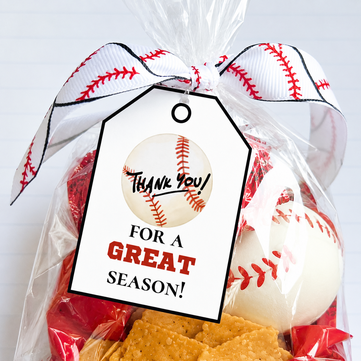 Gift bag with baseball-themed items and a 'Thank you for a great season!' tag.